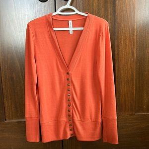 Long sleeved, button Orange Cardigan.  Zenana Outfitters.